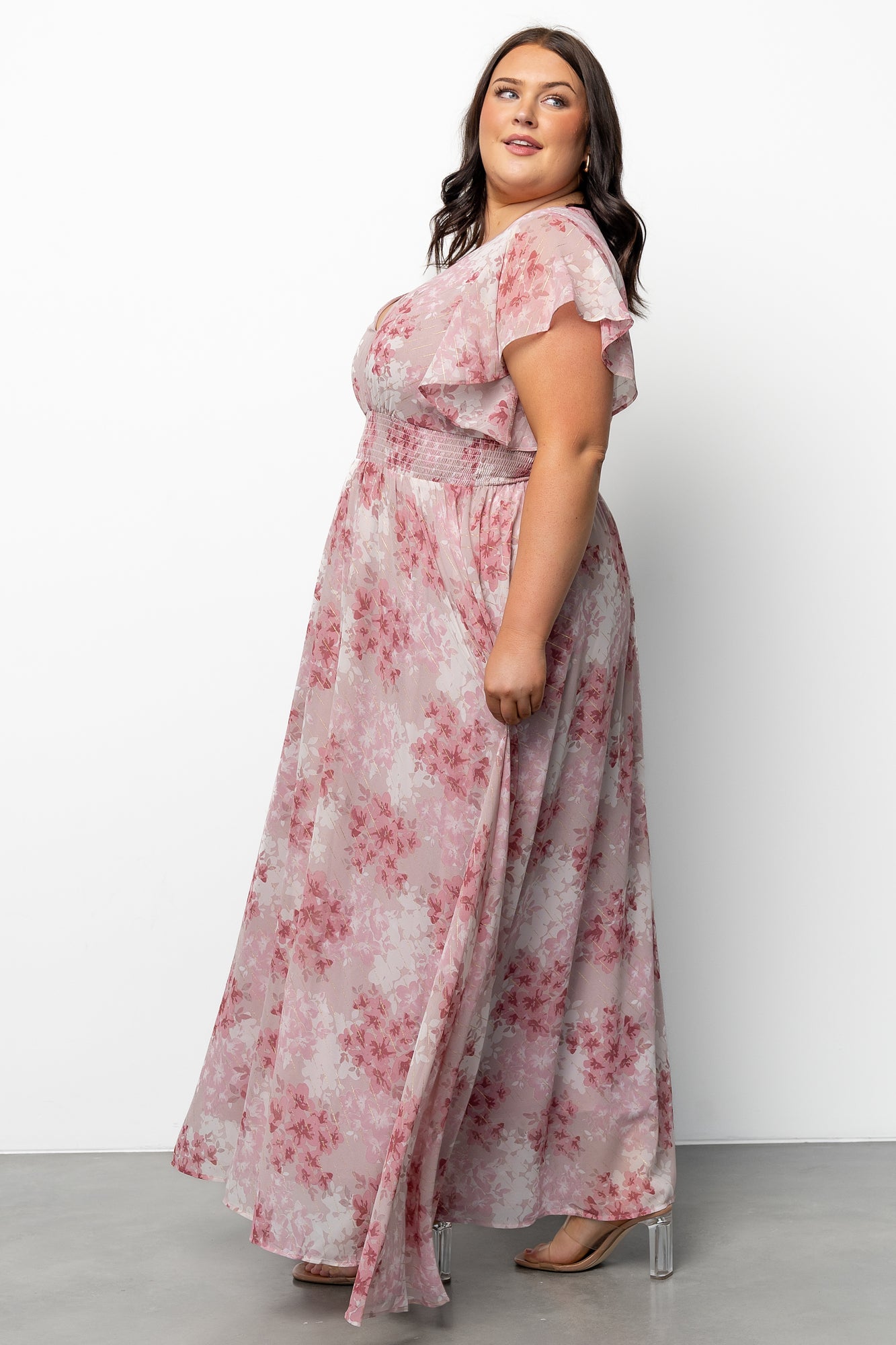 Model twirling in Lynlee Metallic Maxi Dress Pink Multi to illustrate movement of the chiffon skirt and the subtle sparkle of gold metallic highlights.