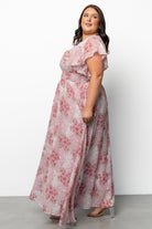 Model twirling in Lynlee Metallic Maxi Dress Pink Multi to illustrate movement of the chiffon skirt and the subtle sparkle of gold metallic highlights.