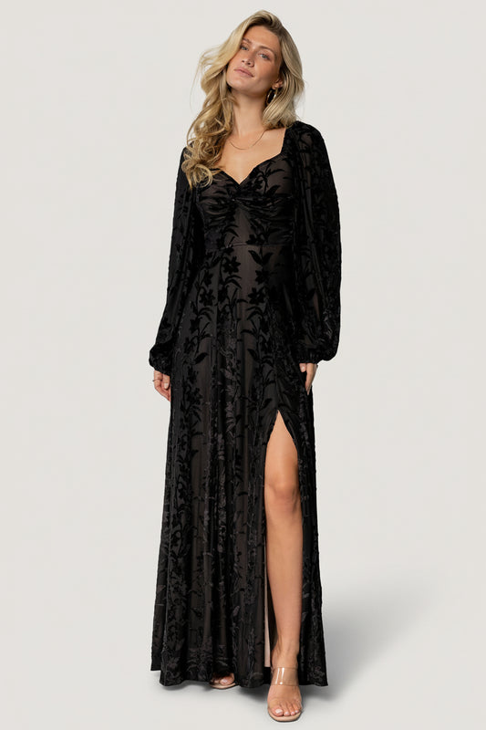 Front view of Aurora Velvet Maxi Dress in black floral burnout over nude lining, showing sweetheart neckline and knotted bust, maxi silhouette.