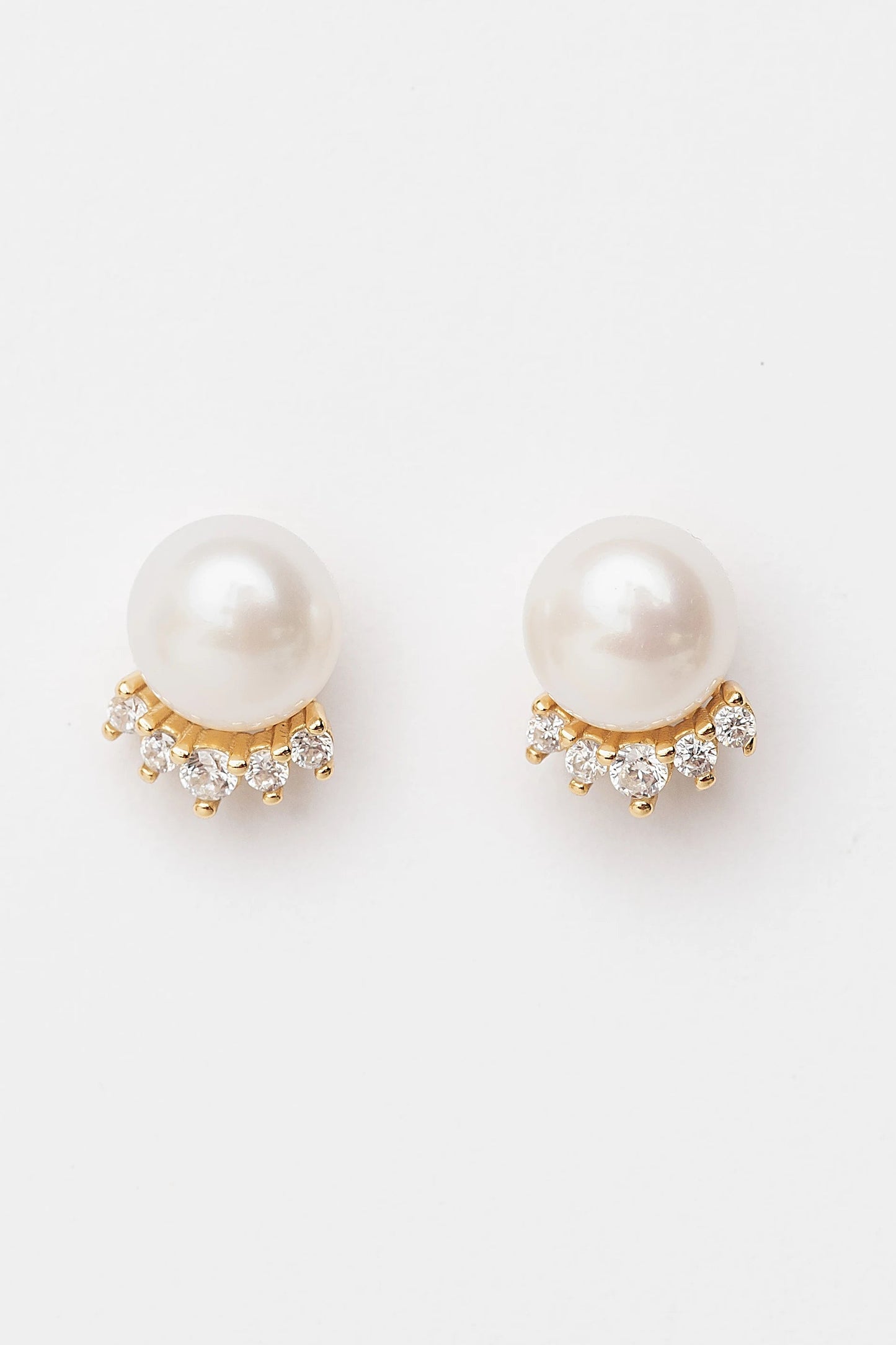 Livvy Gold-Plated Pearl Stud Earrings with luminous pearl centers and polished gold-plated settings.