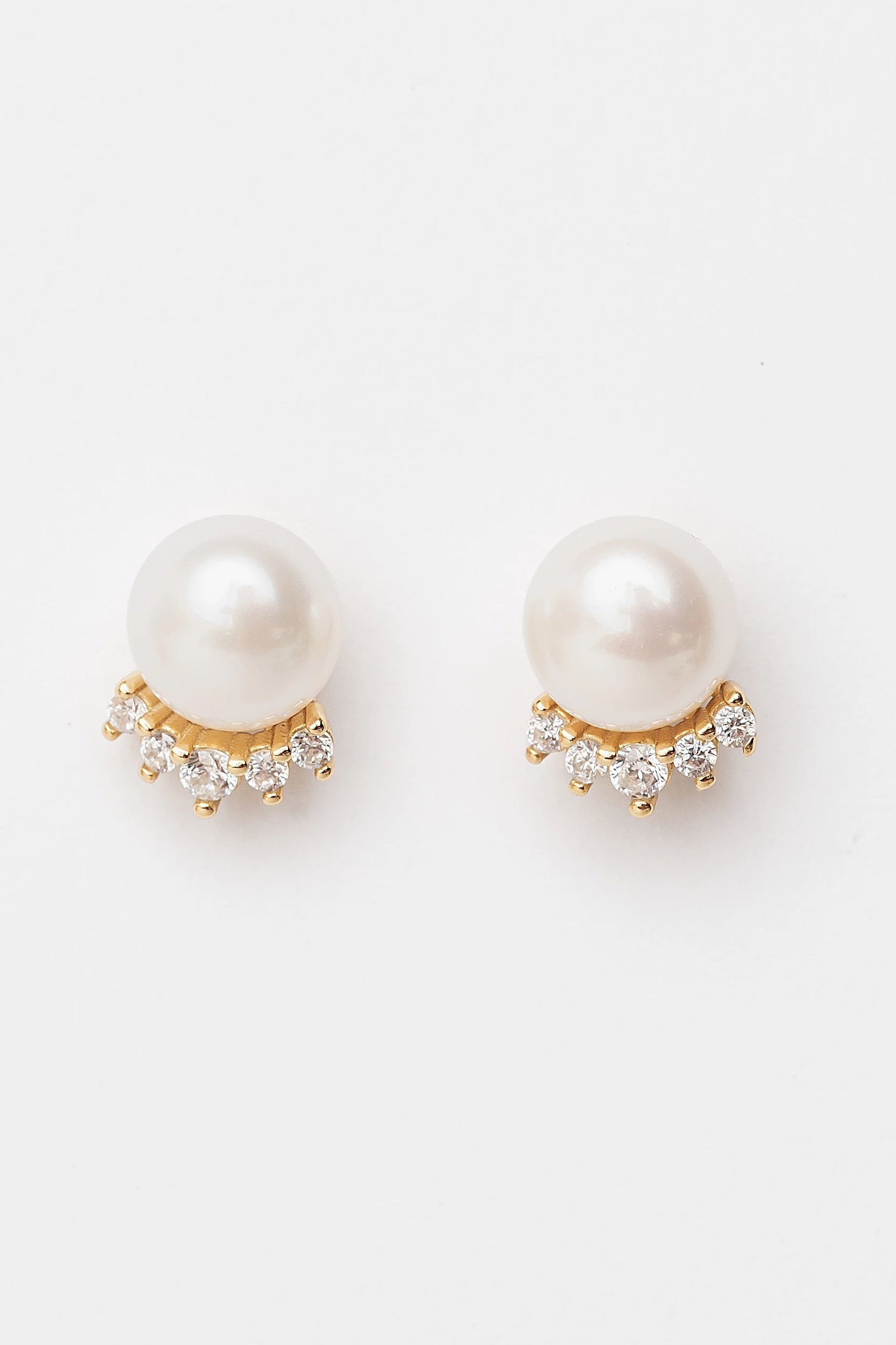 Livvy Gold-Plated Pearl Stud Earrings with luminous pearl centers and polished gold-plated settings.