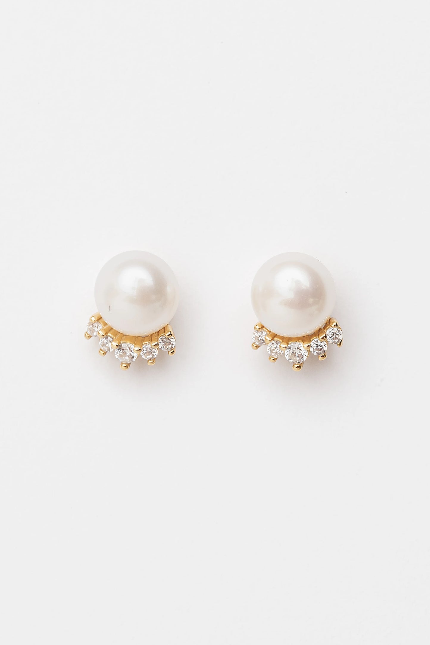 Livvy Gold-Plated Pearl Stud Earrings with luminous pearl centers and polished gold-plated settings.