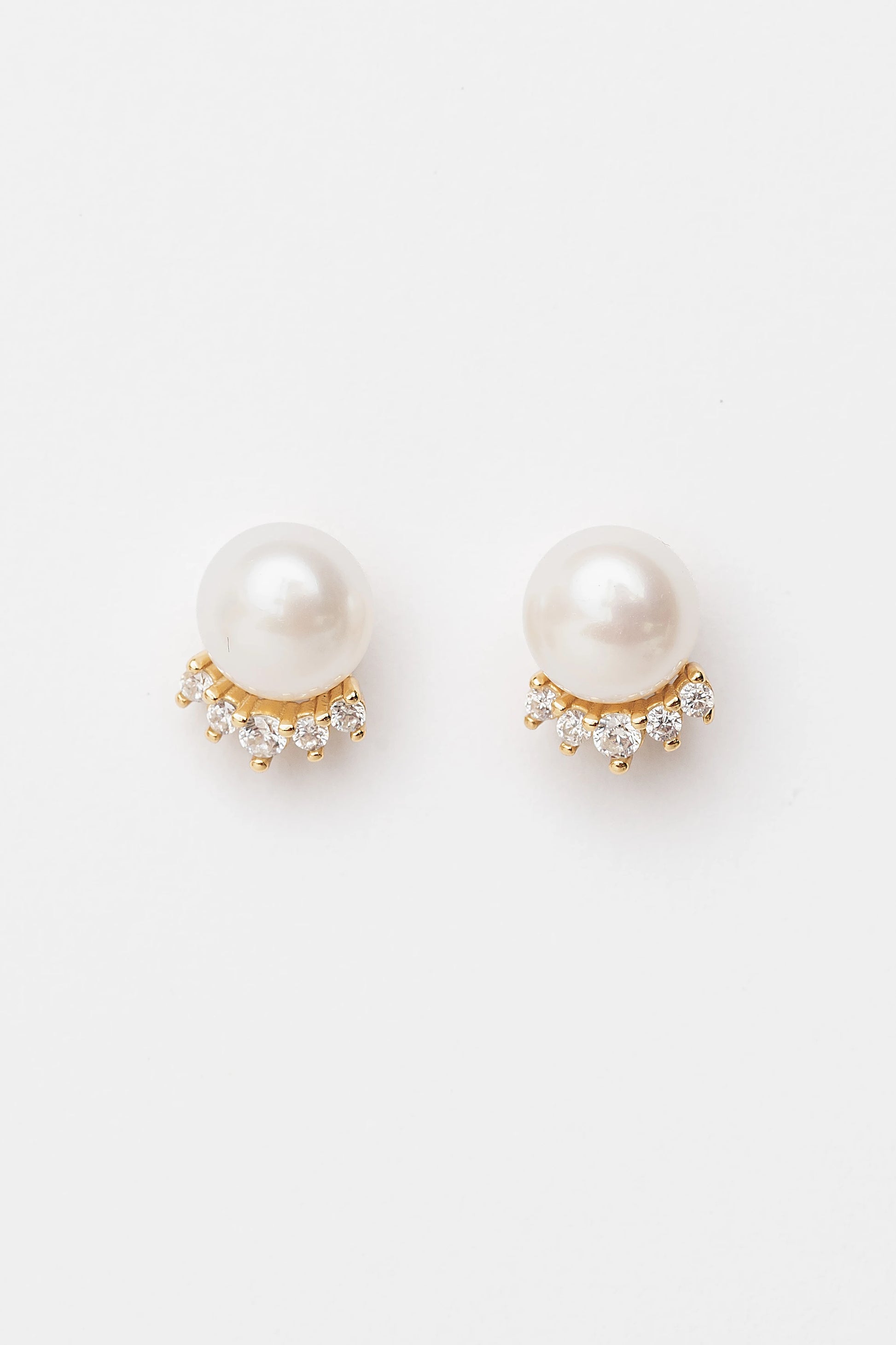 Livvy Gold-Plated Pearl Stud Earrings with luminous pearl centers and polished gold-plated settings.