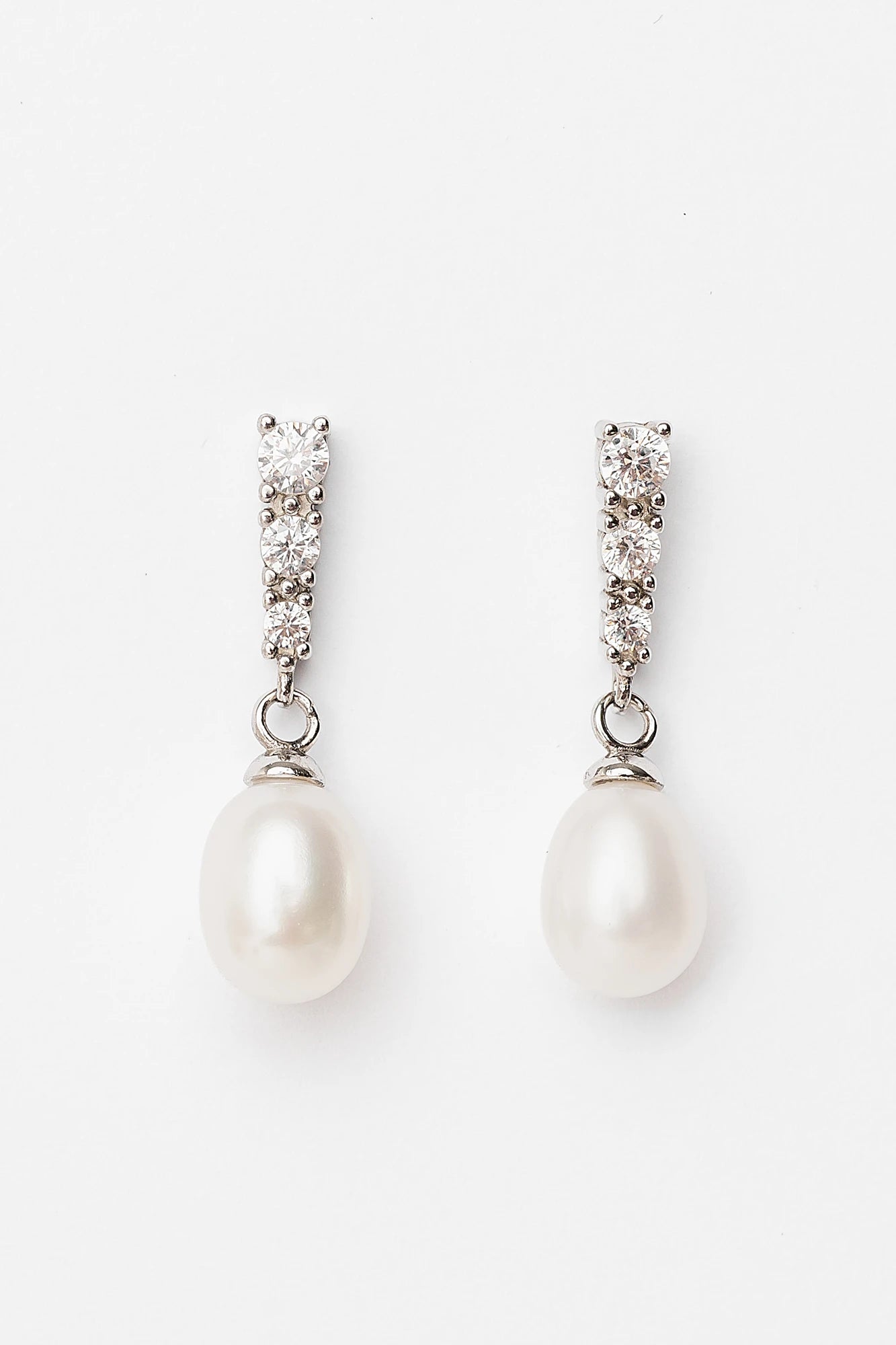 Romona Freshwater Pearl Drop Earrings with luminous pearls and polished sterling silver settings.
