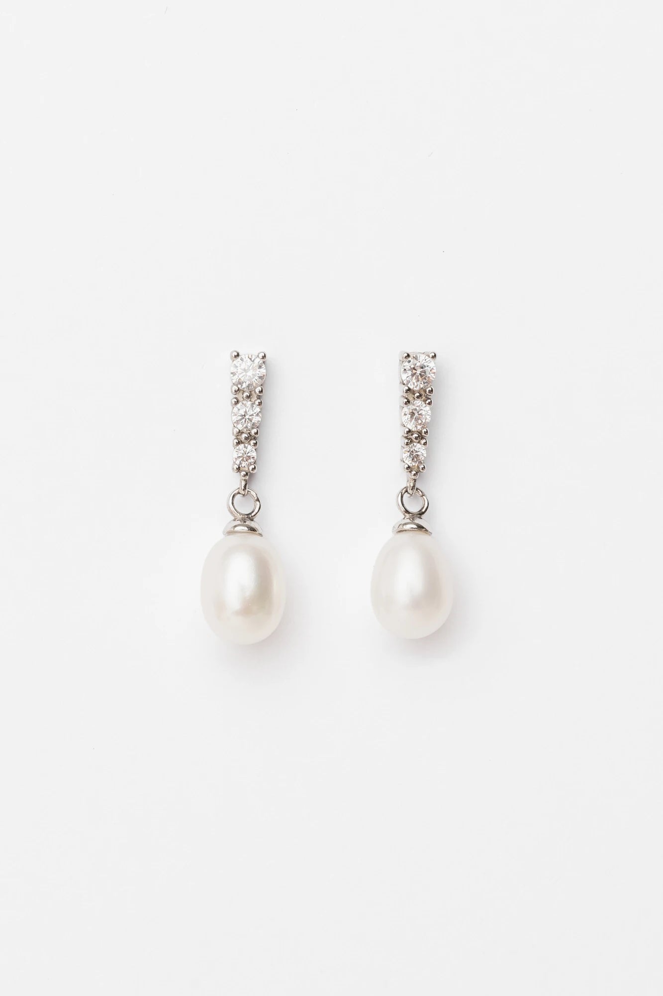 Romona Freshwater Pearl Drop Earrings with luminous pearls and polished sterling silver settings.