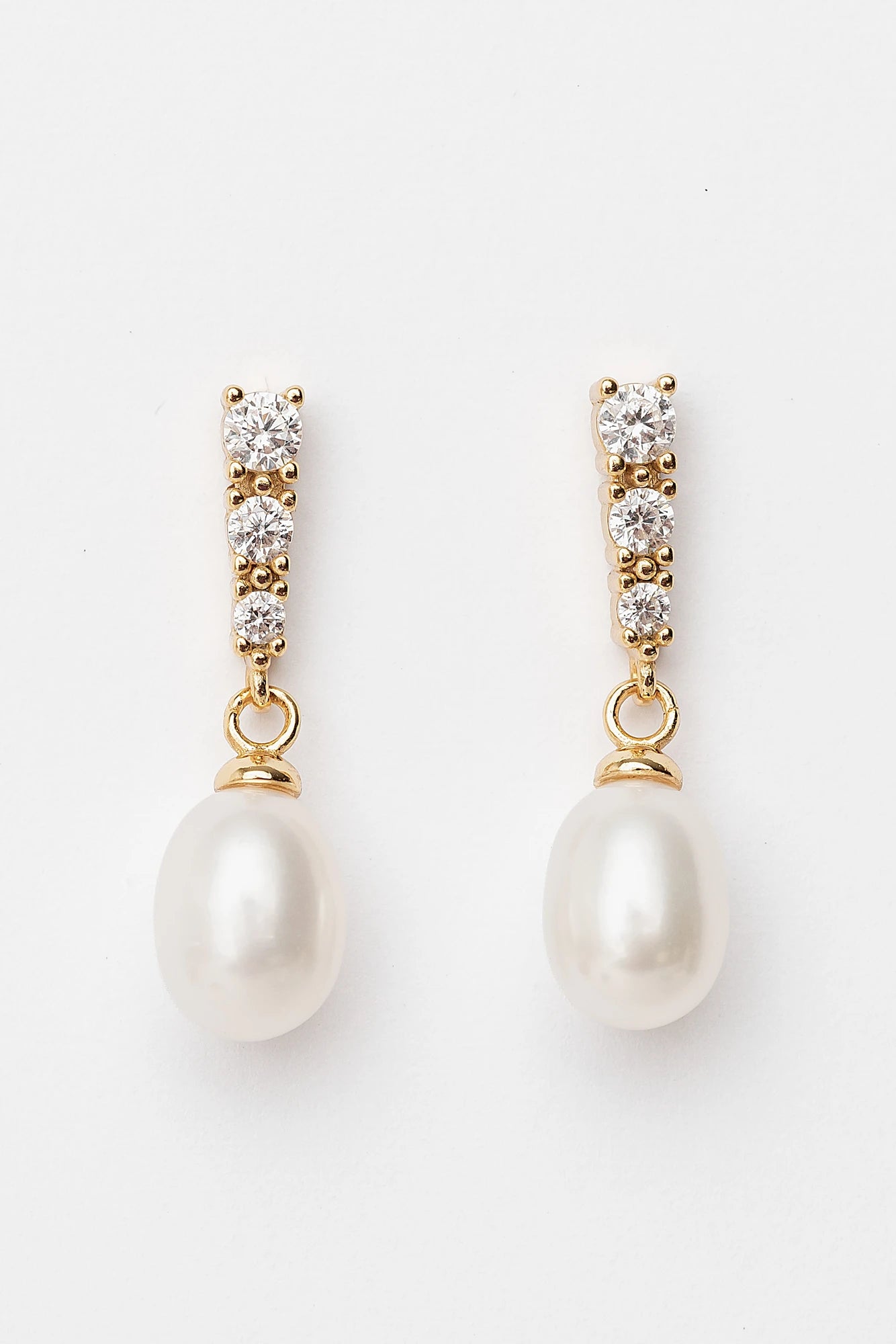 Romona Freshwater Pearl Earrings with luminous pearls and gold-finished sterling silver settings.