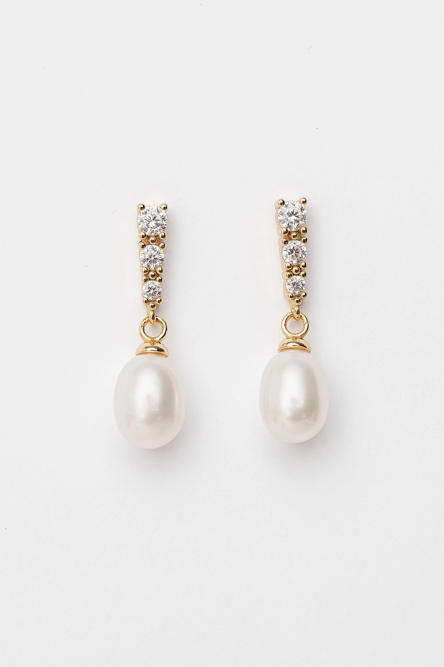 Romona Freshwater Pearl Earrings with luminous pearls and gold-finished sterling silver settings.
