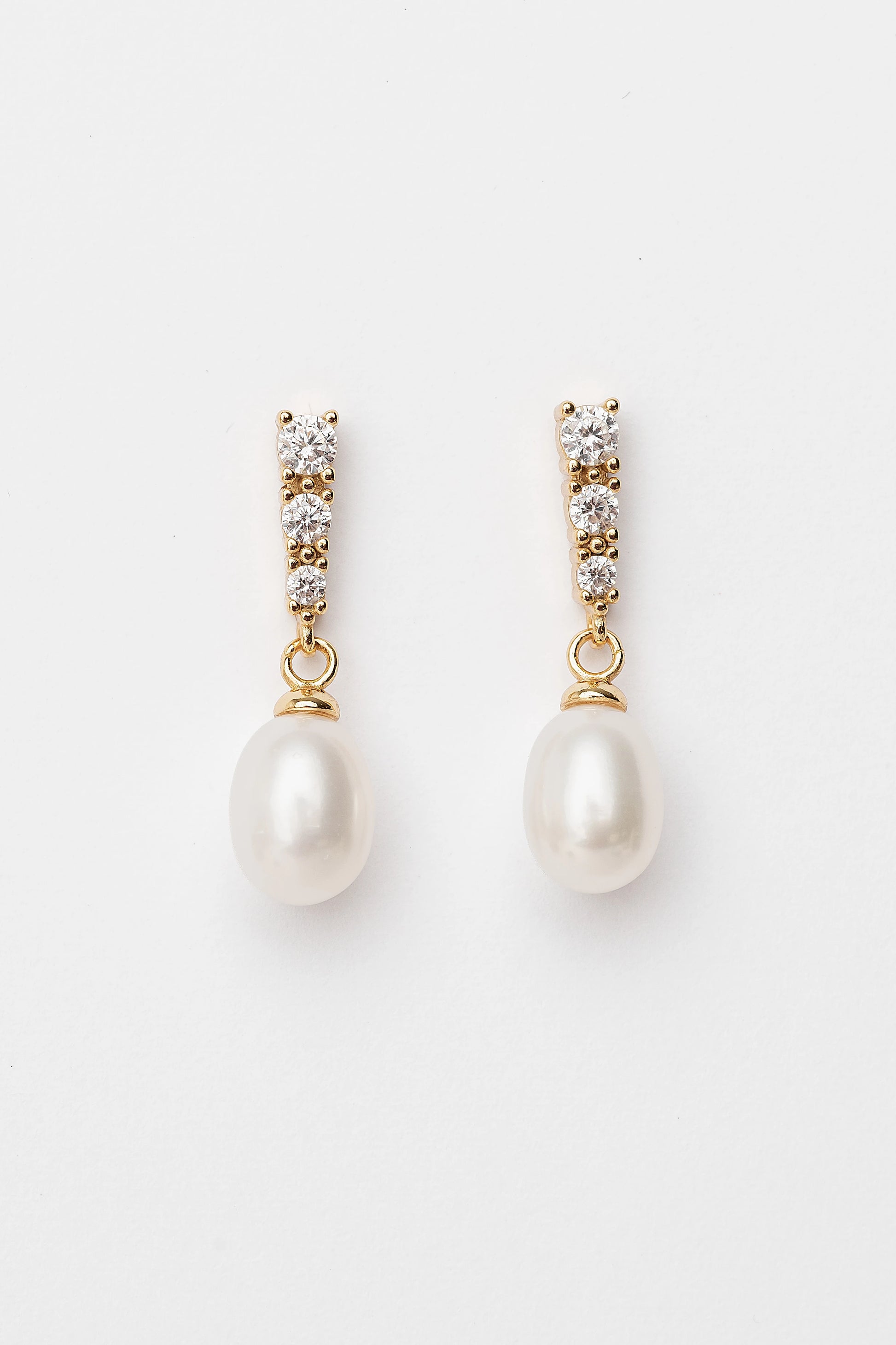 Romona Freshwater Pearl Earrings with luminous pearls and gold-finished sterling silver settings.