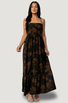 Lifestyle image: model walking in Regan Tank Maxi Dress Espresso Print, showing movement of chiffon tiers and casual elegance.
