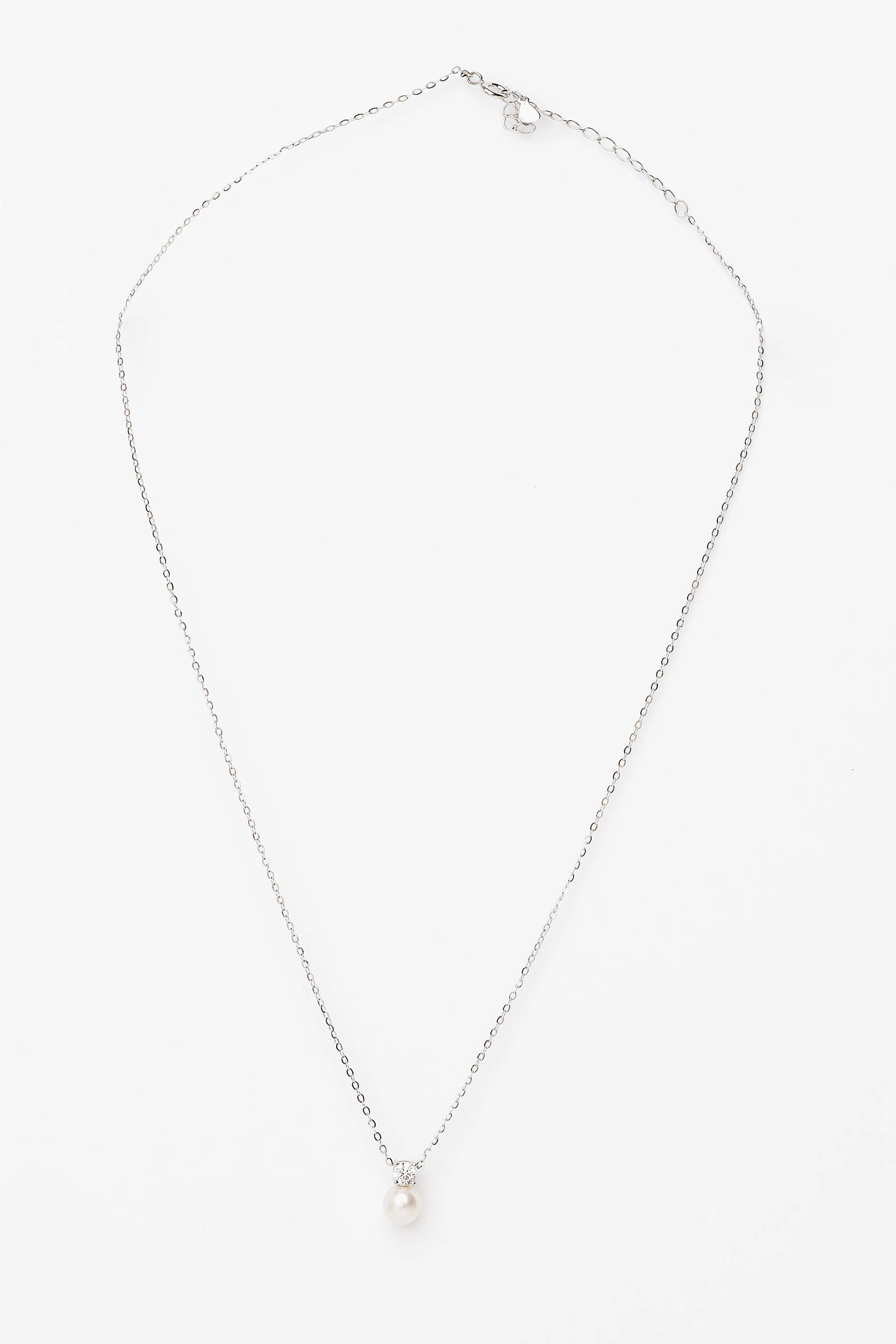 Addilyn Pearl Necklace in Silver with freshwater pearl pendant, moissanite accent, and delicate silver-tone chain.