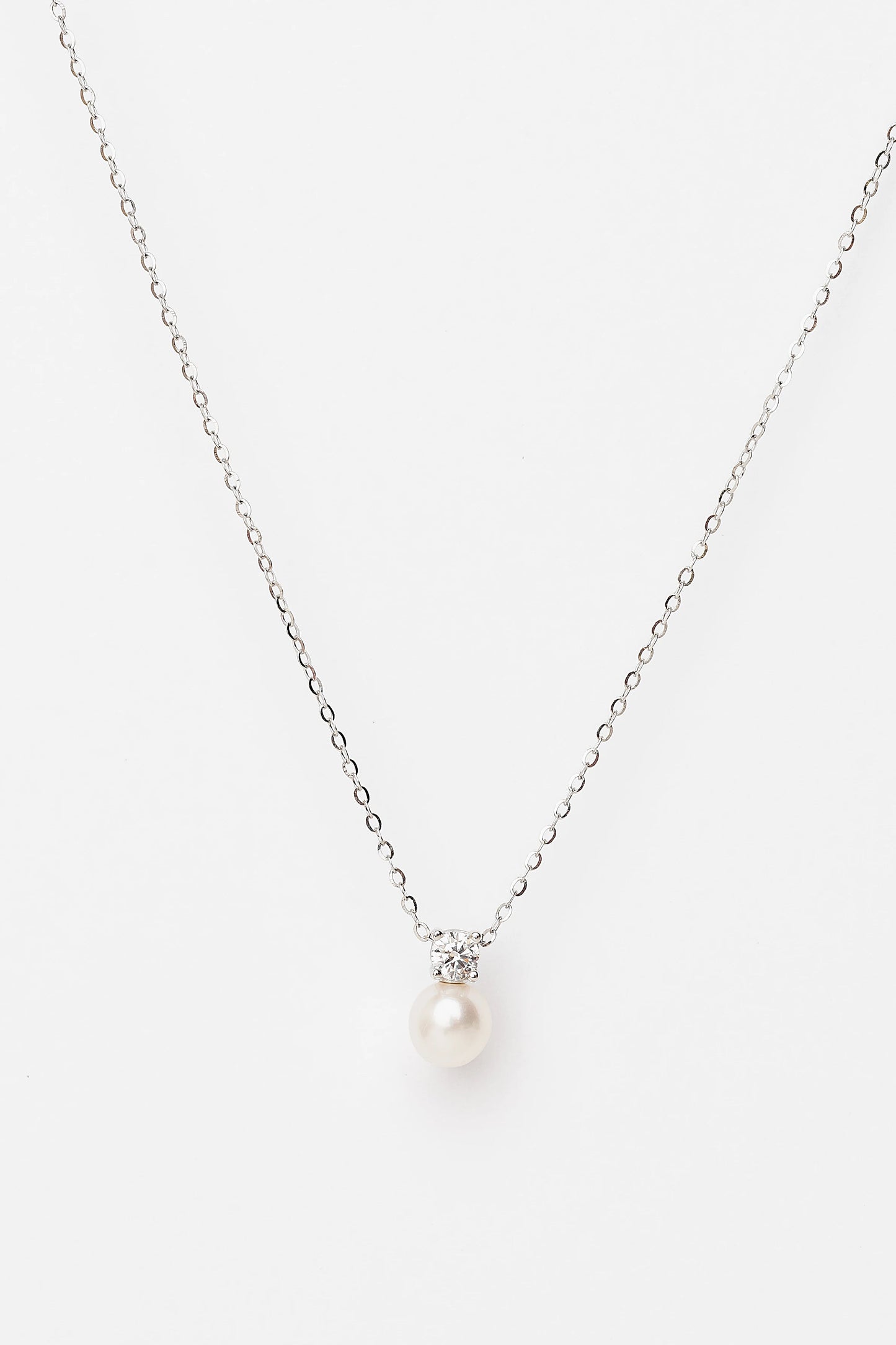 Addilyn Pearl Necklace in Silver with freshwater pearl pendant, moissanite accent, and delicate silver-tone chain.
