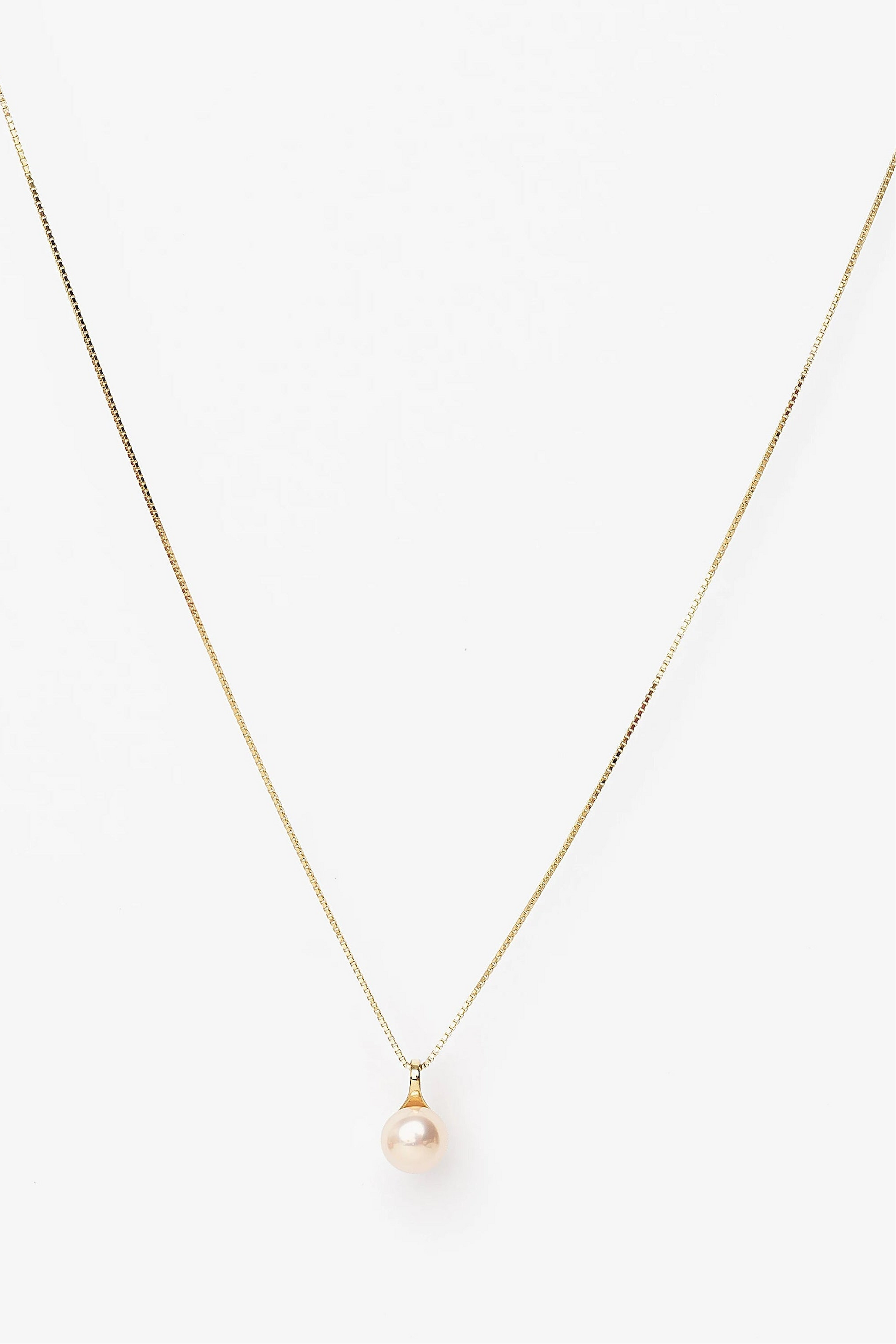 Tanaia Pearl Necklace in Gold with a freshwater light pink pearl and delicate gold-tone chain.