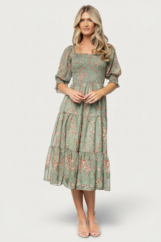 Close-up of the Fabian jacquard fabric in eucalyptus and pink, highlighting textured woven floral details and subtle color variation.