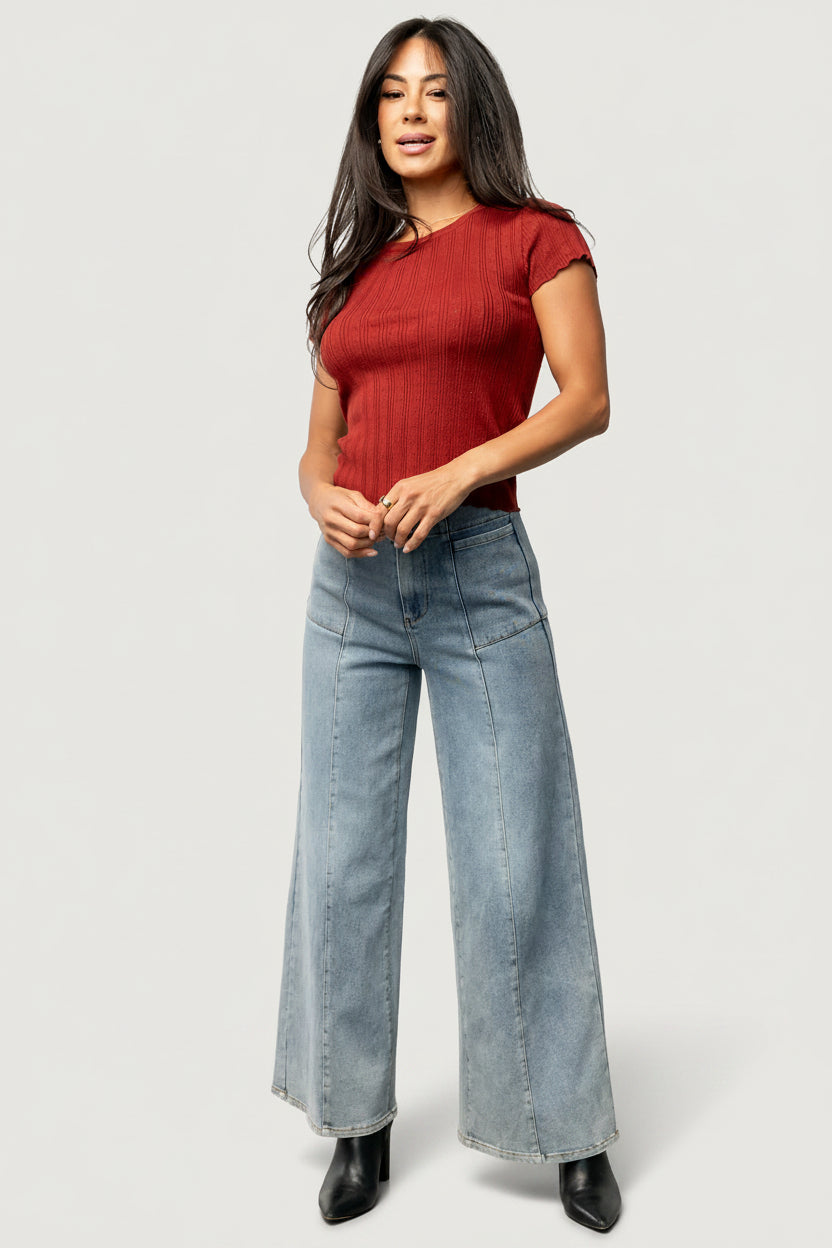 Back view of the Penny Pointelle top in brick on model, displaying ribbed back texture and clean, unlined construction.
