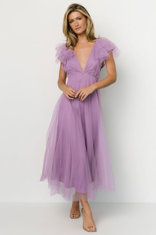 Front view of Annabella Tulle Midi Dress in lavender on model, V-neck, ruffle tank sleeves, layered tulle and tied open back, styled for events.