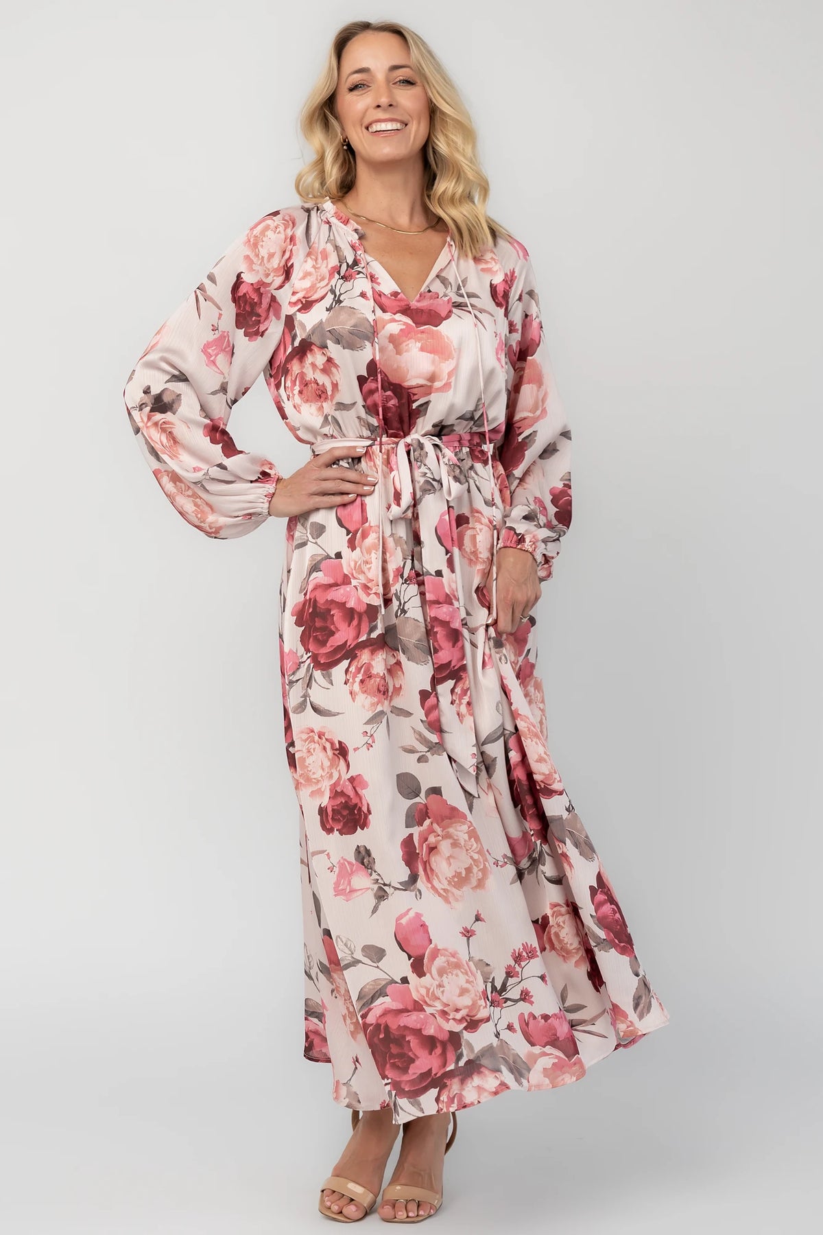Rose floral maxi dress with a split V-neckline, ruffle-trimmed collar, long balloon sleeves, removable self-tie belt, and a flowing maxi skirt.