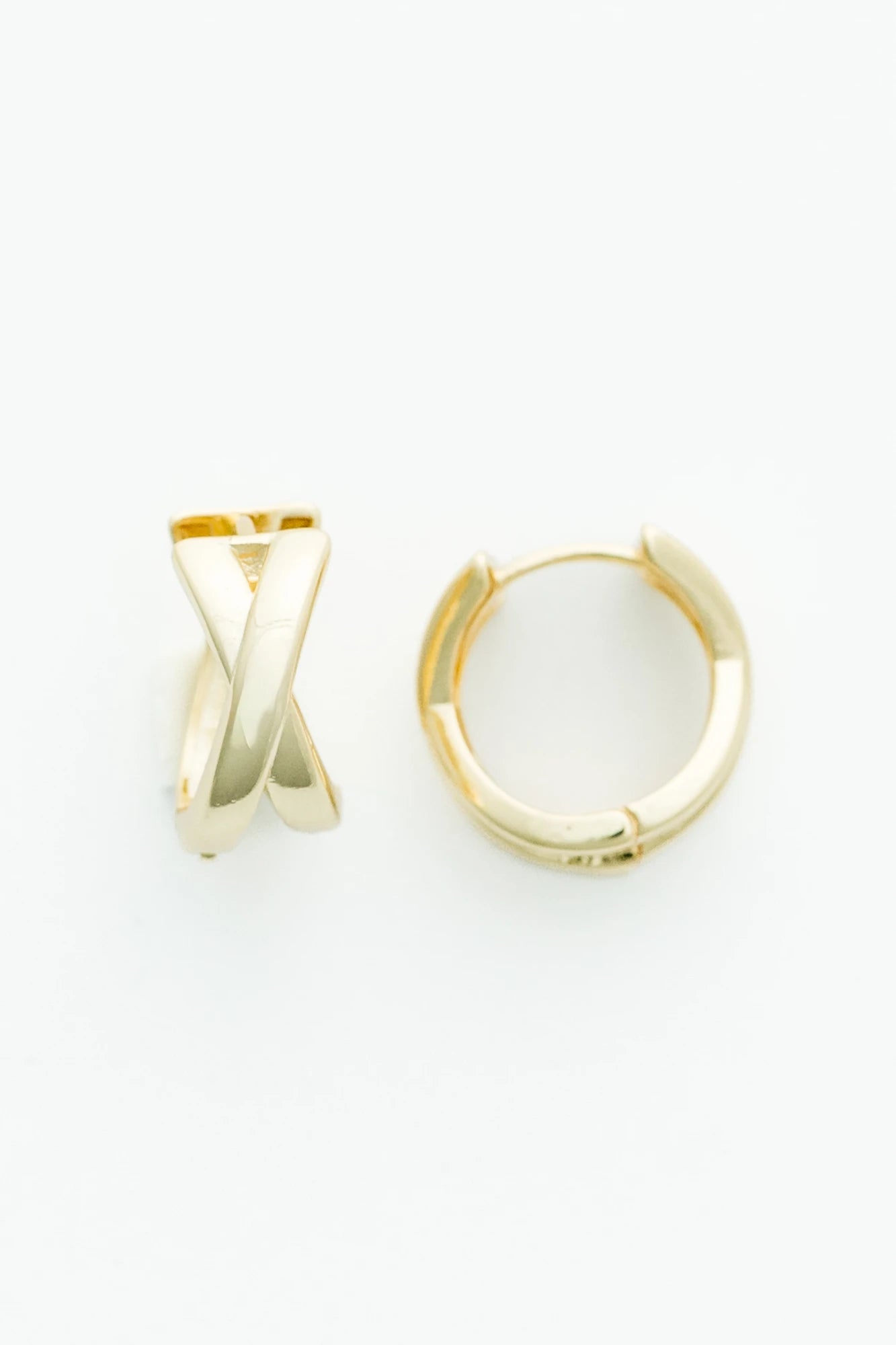 Gold-tone huggie earrings with a polished finish