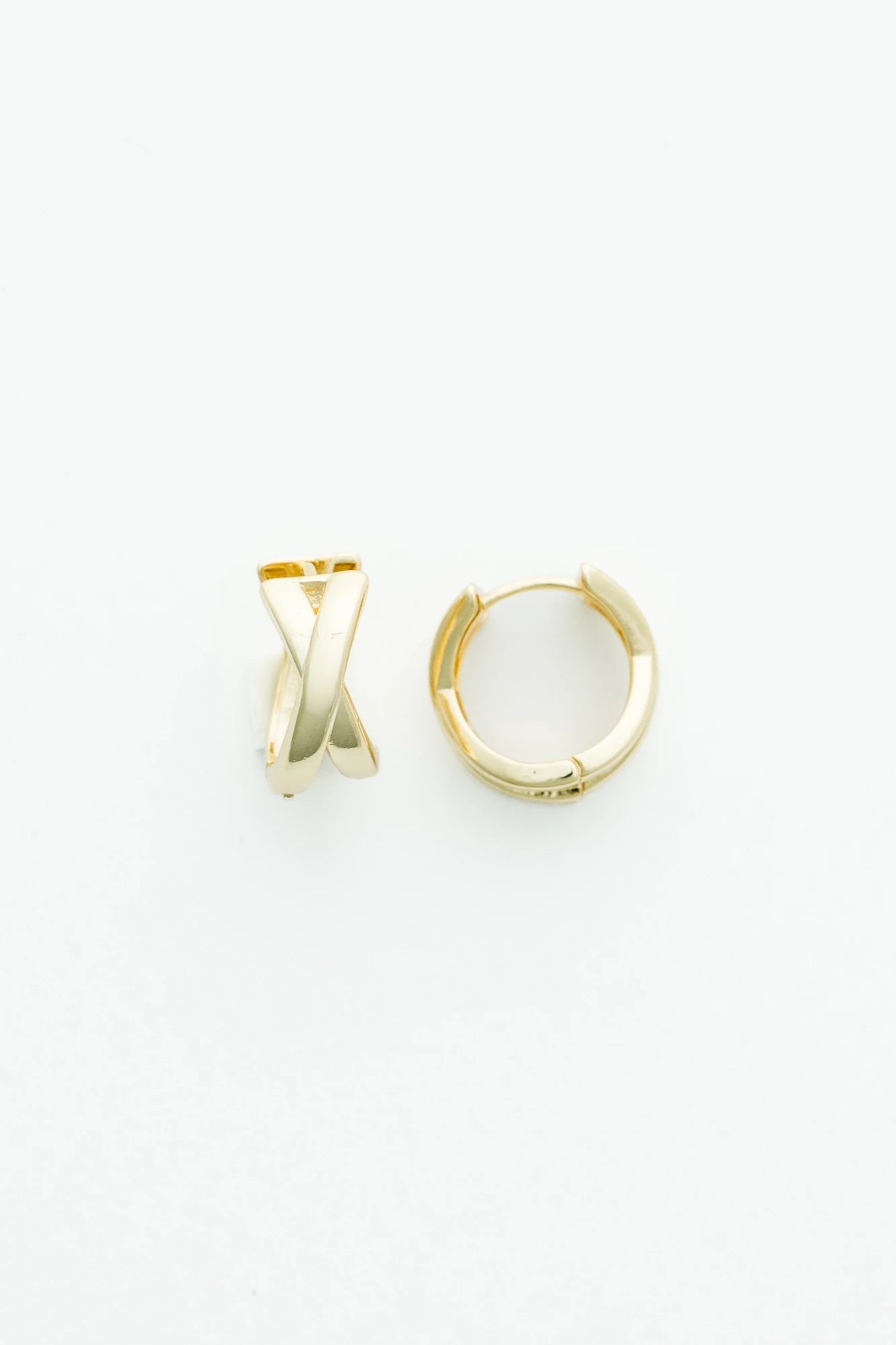 Gold-tone huggie earrings with a polished finish