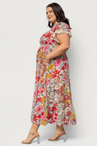 Side view showing Aliyah midi dress pockets and gentle drape of rayon fabric, highlighting ease and everyday wearability.