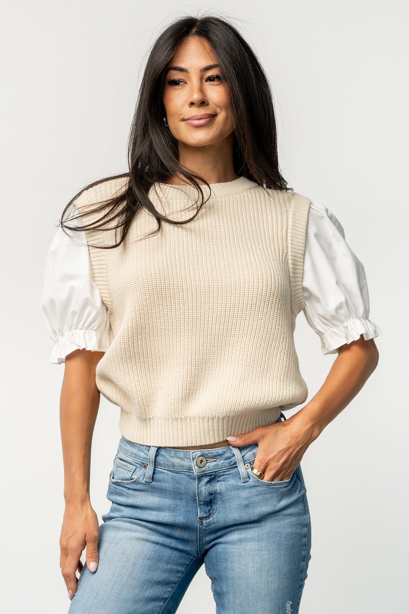 Three-quarter view of the Taylor Puff Sleeve Top showing cream knit body and ivory puff sleeve contrast with subtle volume at the cuff.