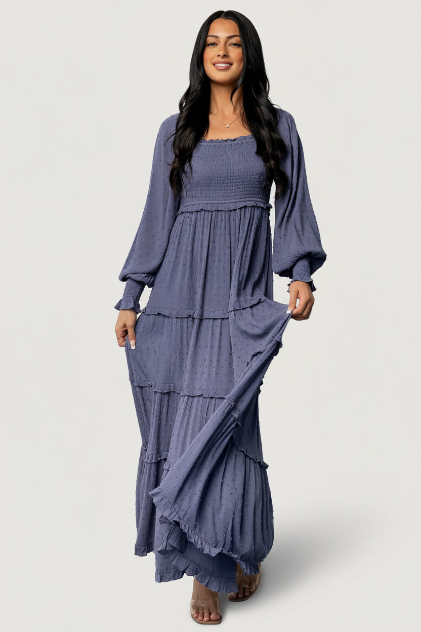 Close-up of smocked sleeve cuff and fabric detail on the dusk blue dotted Amanda maxi, showing texture and gentle stretch.
