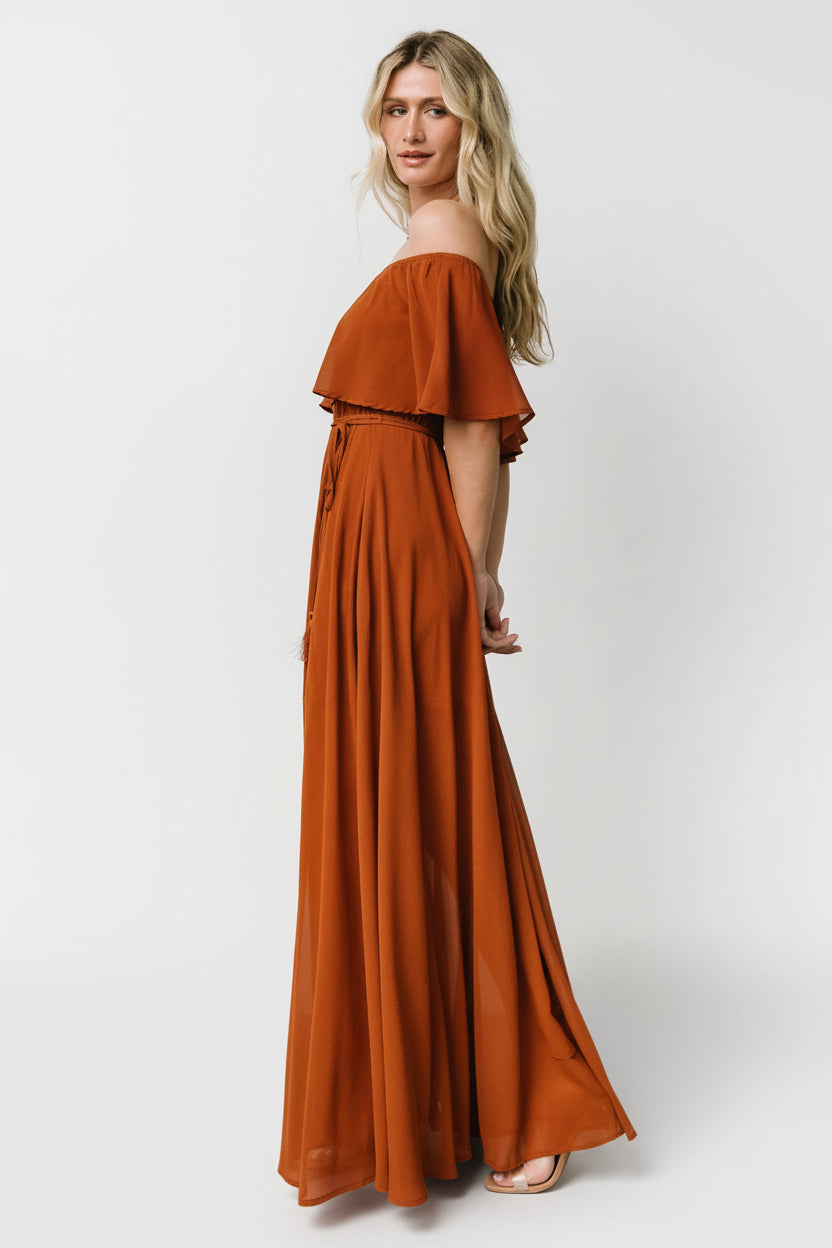 Close-up of elastic top hem and off-shoulder neckline detail on the Spice maxi dress, showing fabric texture and fit.