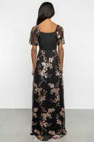 Back view showing smocked back bodice, elastic at the waist, and the gentle drape of the fully lined skirt.