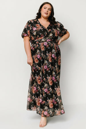 Front view of Ardley Maxi Dress in black multi floral showing V-neck, short puff sleeves, embroidered mesh overlay, and flowing maxi skirt.