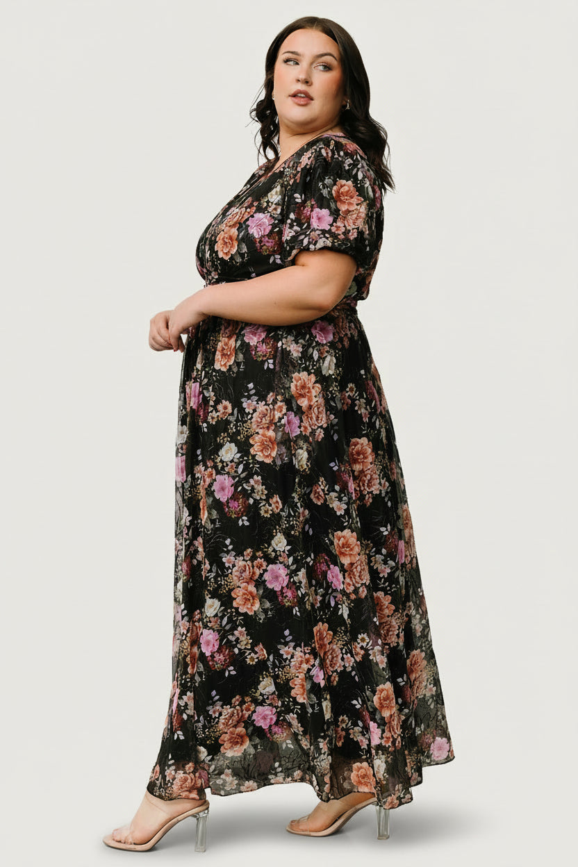 Detail image of the Ardley Maxi Dress waist gathering and skirt flow with embroidered accents on the black multi floral print.