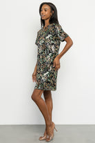 Styled product image showing lining and interior finish of the sequin short dress, emphasizing fully lined construction for comfort.