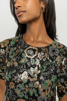 Full-length shot of the Squires sequin short dress on model, illustrating short skirt length and overall silhouette for occasion wear.
