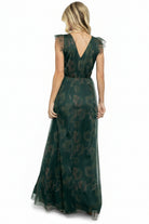 Detailed view of the green floral tulle overlay on the Adelyn Maxi Dress showing print, texture, and layered fabric.
