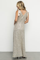 Styled look of the Saya sequin maxi dress paired with minimal accessories, highlighting movement and evening-ready sparkle.
