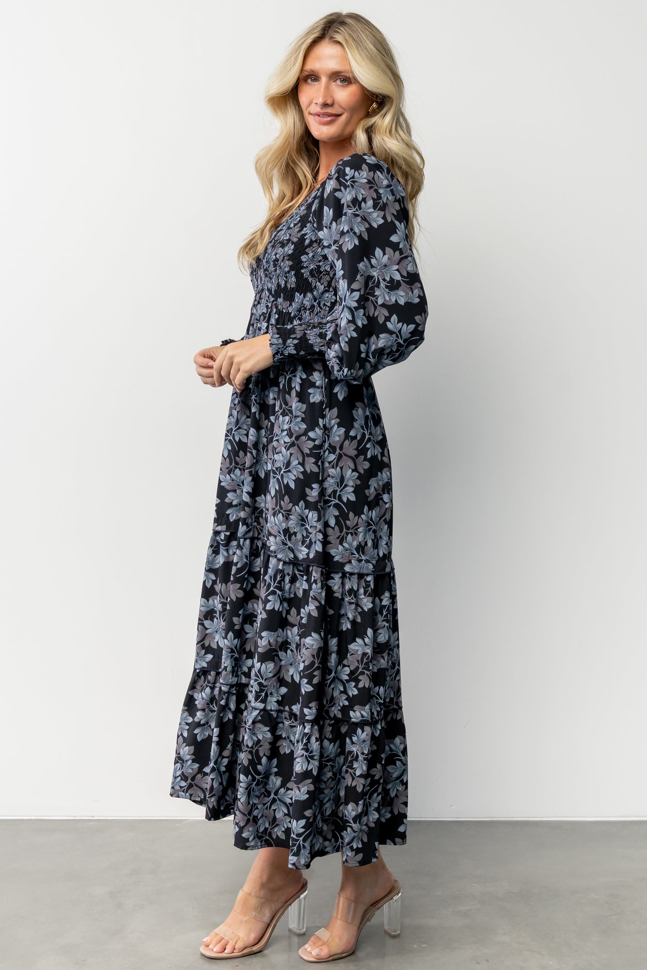Back and hem detail of the Rayna Smocked Maxi Dress illustrating length, lining coverage, and gentle skirt tiers.