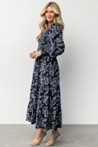 Back and hem detail of the Rayna Smocked Maxi Dress illustrating length, lining coverage, and gentle skirt tiers.