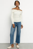 Back view of Perla sweater on model showing overall fit, seam lines, and lightweight unlined construction.