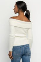 Styled outfit image with Perla ivory sweater paired with high-rise wide leg jeans to show casual styling option.