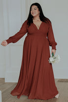 Close-up of Olivia Maxi Dress in cinnamon showing smocked sleeve cuff and lightweight chiffon texture, highlighting delicate drape and finish.