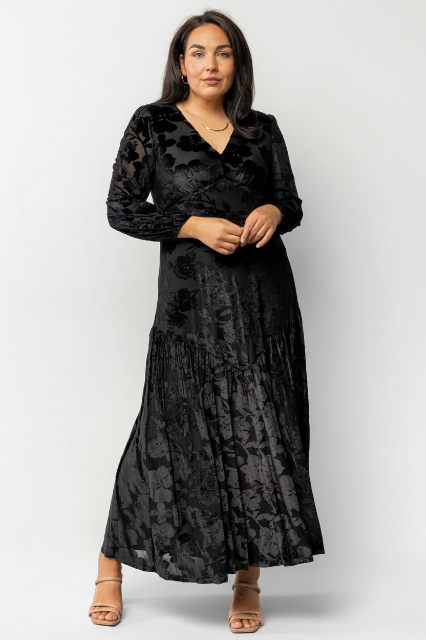 Detail shot of upward V bust seam with subtle gathering and V-neckline showing construction and flattering shaping at the bust.