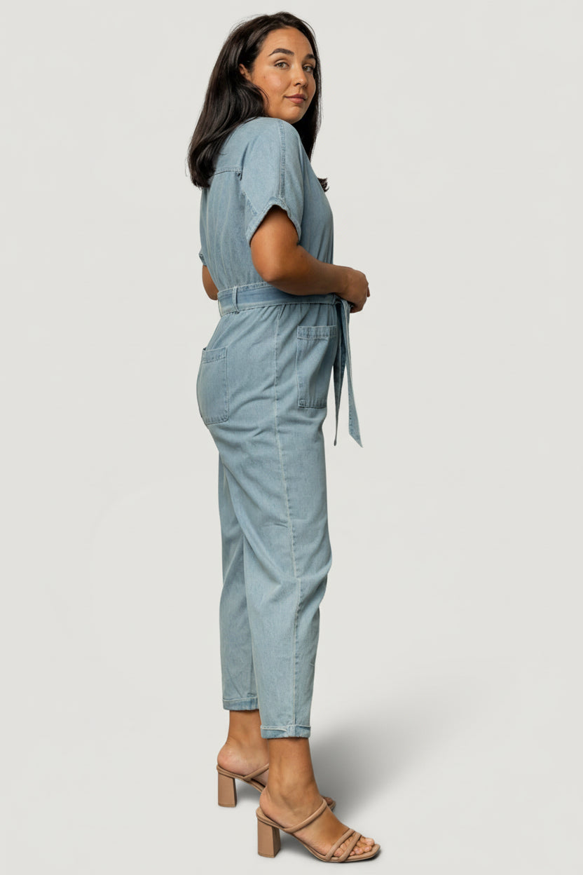 Fabric close-up showing denim-like weave and soft hand of the Mateo jumpsuit's 97% cotton, 3% polyester blend.