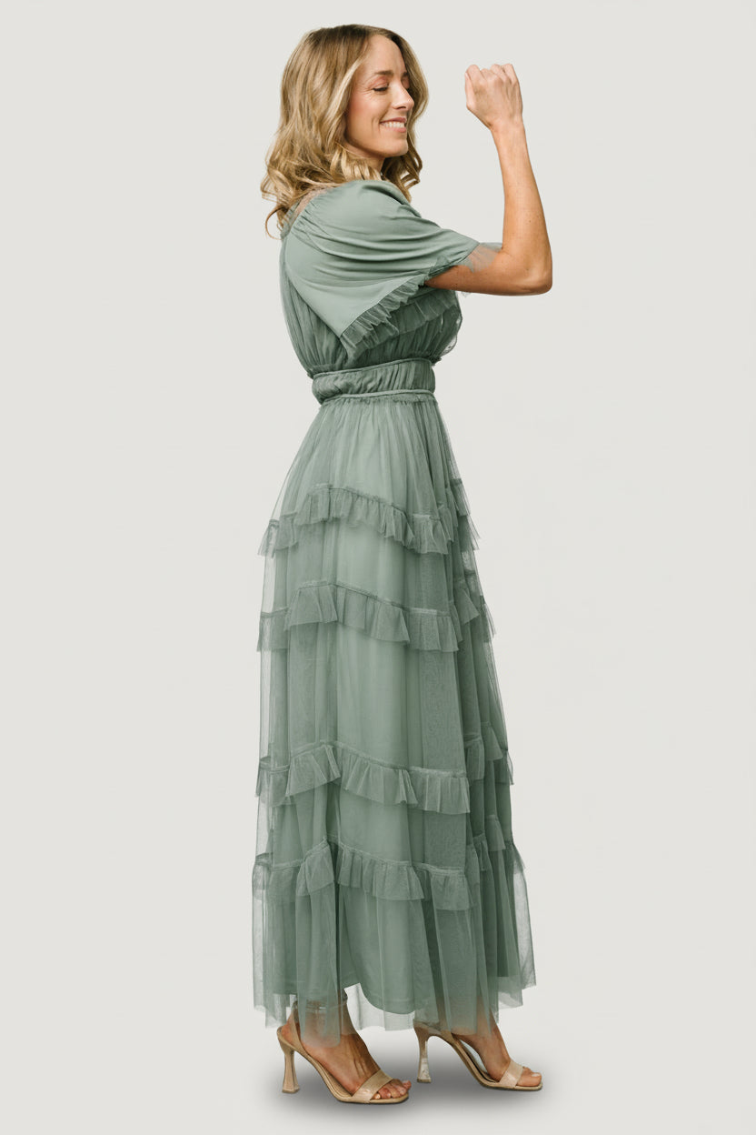 Styled editorial image of the Magdalena Tulle Maxi Dress in eucalyptus, highlighting layered tulle skirt and soft romantic styling.