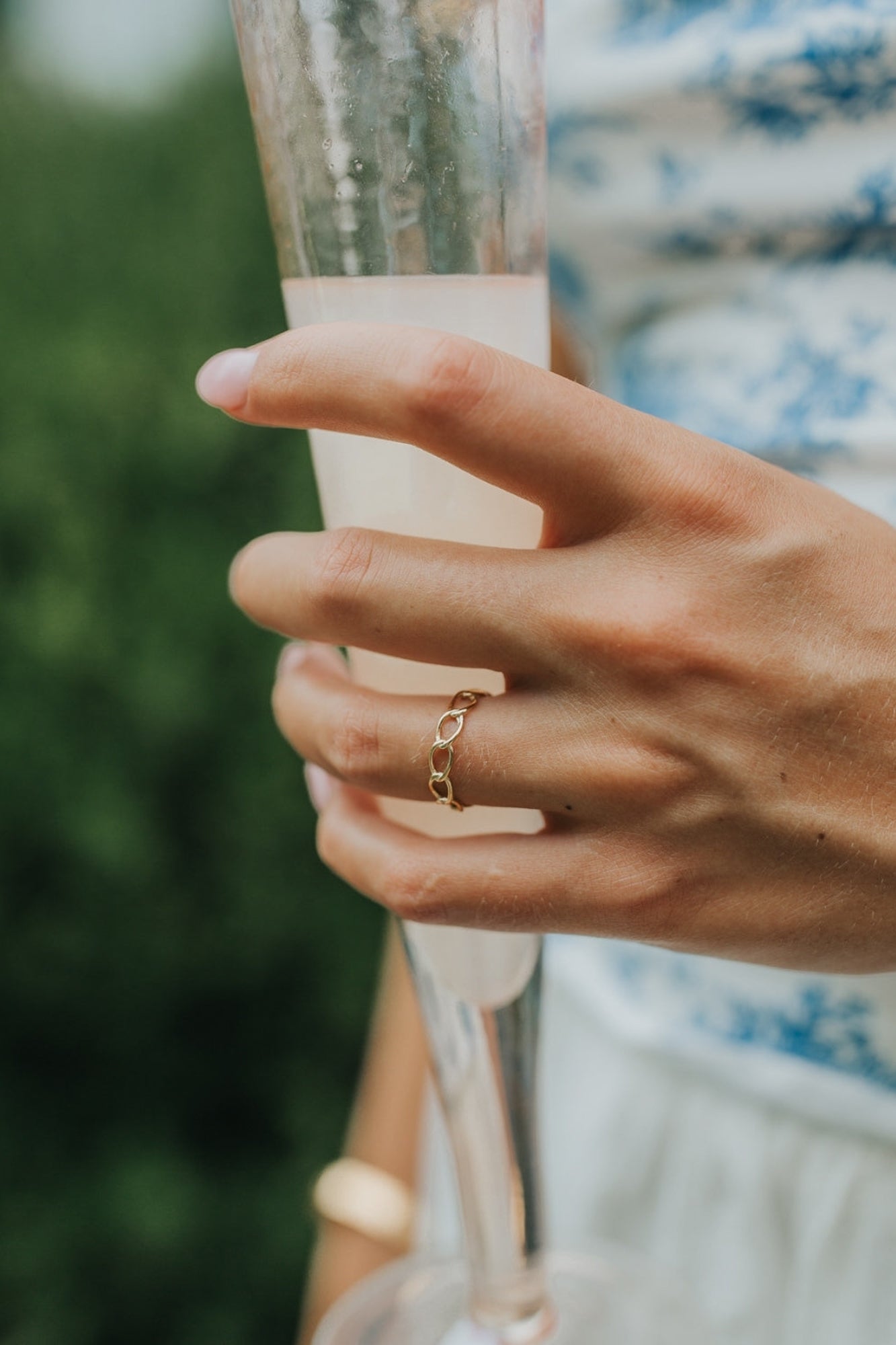 Macro image of The Emma Ring focusing on the polished link joins and smooth gold-plated surface, demonstrating texture and shine.