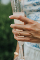 Macro image of The Emma Ring focusing on the polished link joins and smooth gold-plated surface, demonstrating texture and shine.