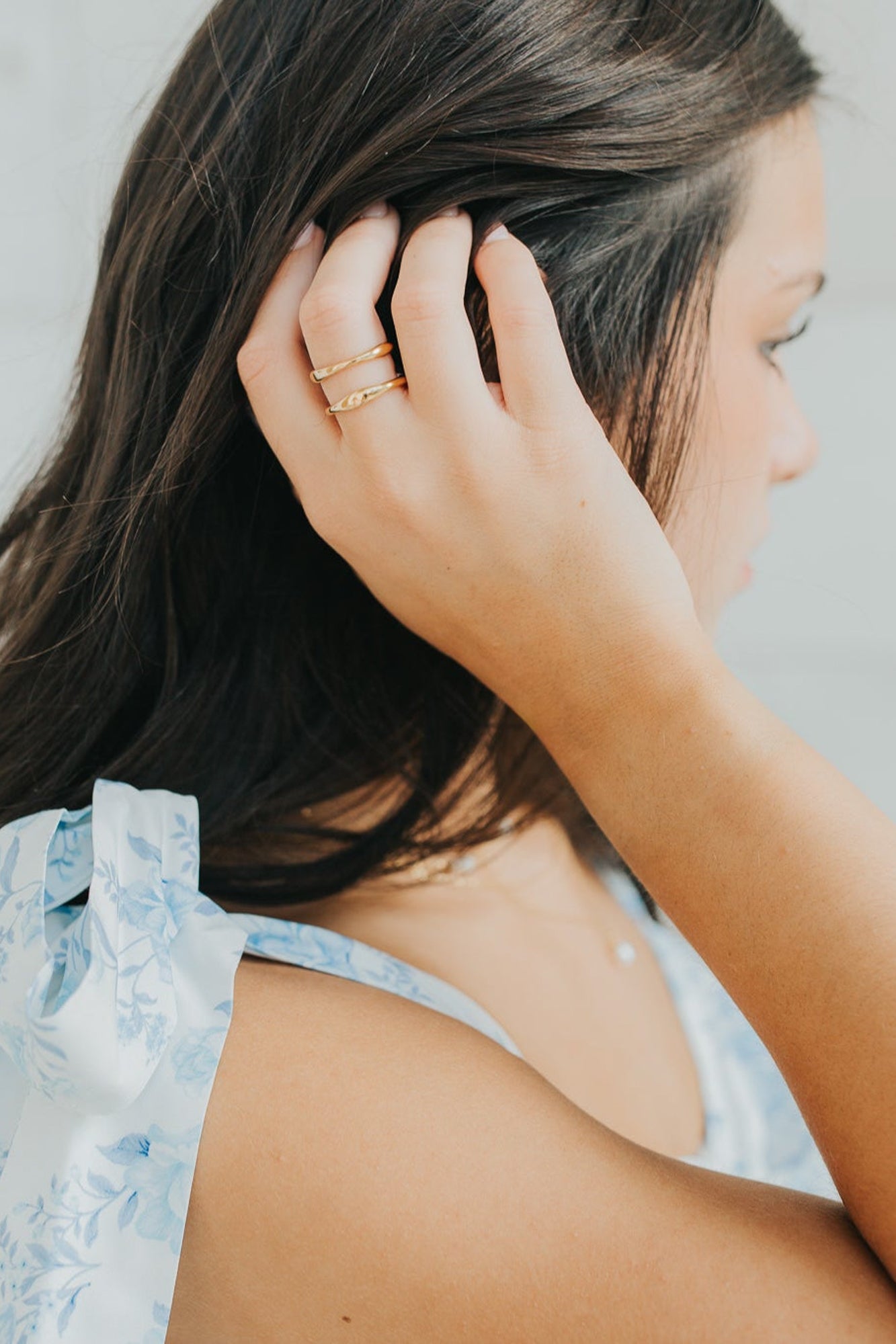 Studio-lit macro of the Florence ring highlighting the smooth interior, wave profile, and the durable gold-plated, tarnish-resistant surface.