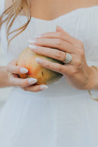 Studio detail image of the Alys ring rotated to display the vertical mother-of-pearl panels and the wide, architectural band silhouette.
