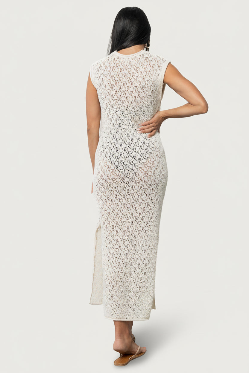 Side view of Calypso cover-up showing 17.5-inch side slit, short drop shoulder sleeve, and natural shade worn over a swimsuit.
