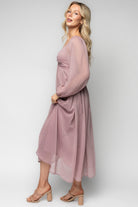 Detail shot of puffed sleeve and elastic shoulder on the Dione Midi Dress in dusty lilac, showing the unlined sleeve and soft georgette fabric.