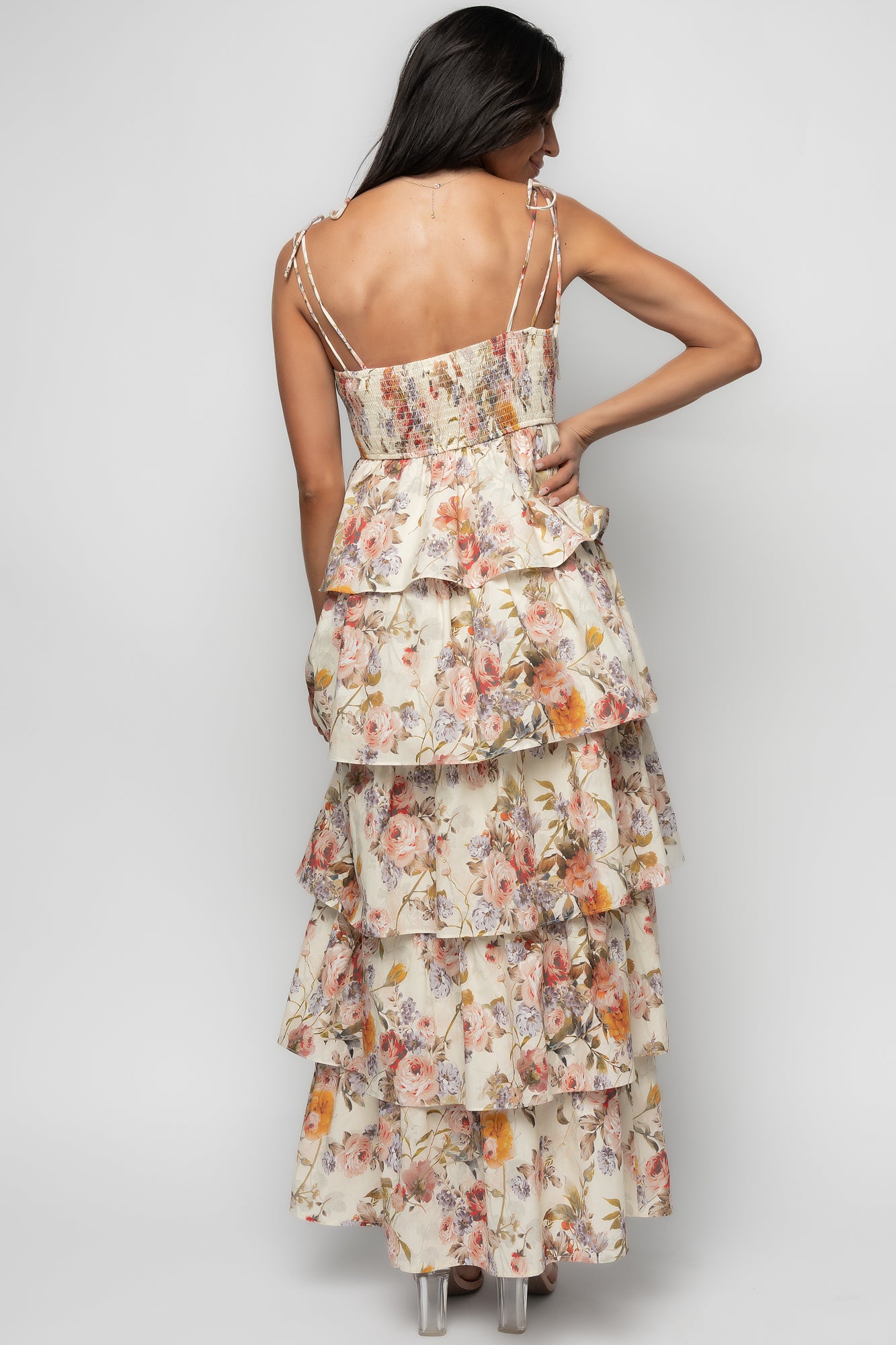Close-up of the twist bust detail and V-neckline on the Angelica dress, highlighting smocked back and adjustable tie straps for a customizable fit.