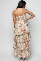 Close-up of the twist bust detail and V-neckline on the Angelica dress, highlighting smocked back and adjustable tie straps for a customizable fit.