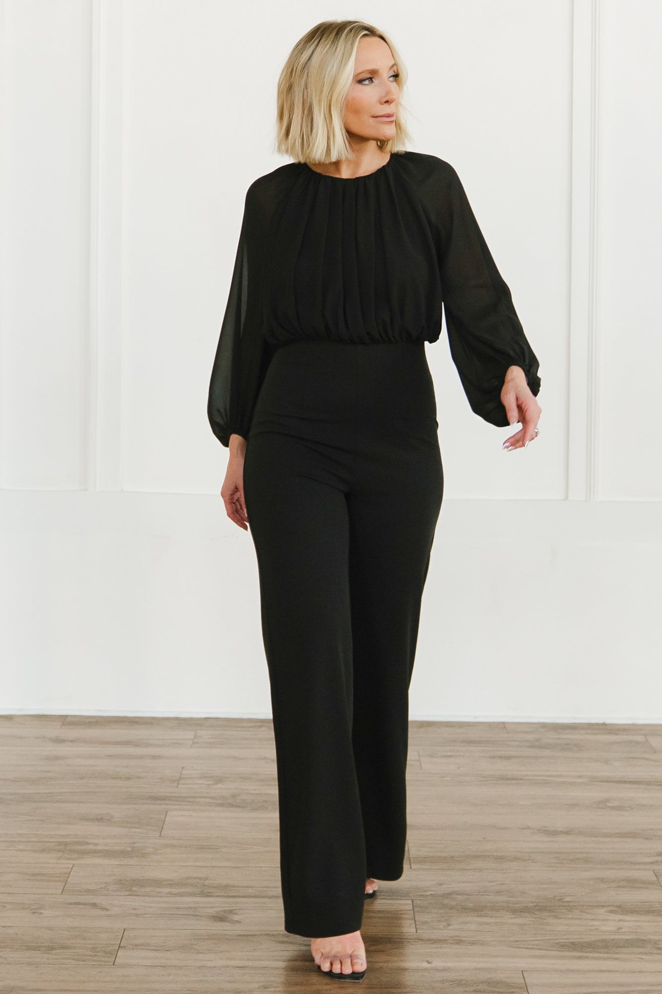 Back view of Serene Blouse Jumpsuit showing back neck tie with keyhole, hidden zipper and gathered neckline pleating.
